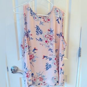 Delicate pink sleeveless blouse with crochet detail around edges.